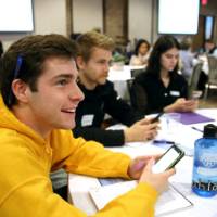 A student texts in a personality characteristic during an interactive activity